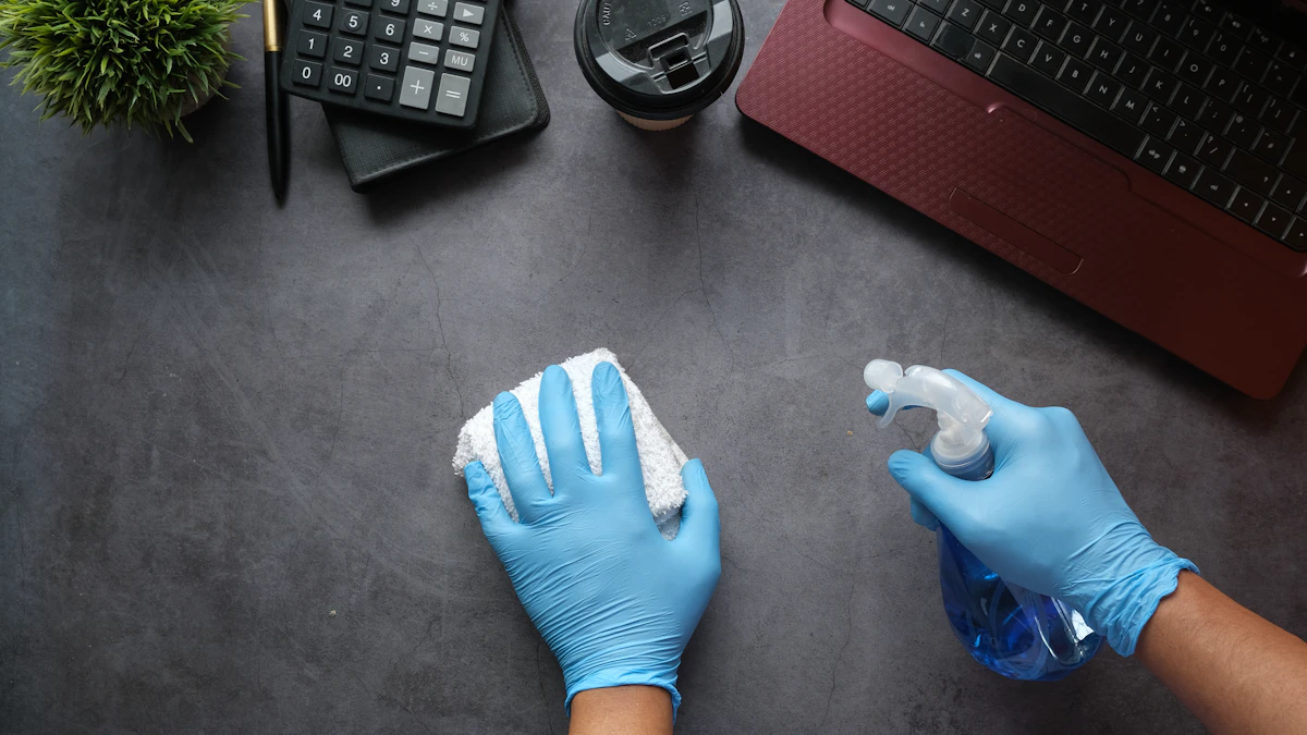 Gloved professional cleaning an office desk