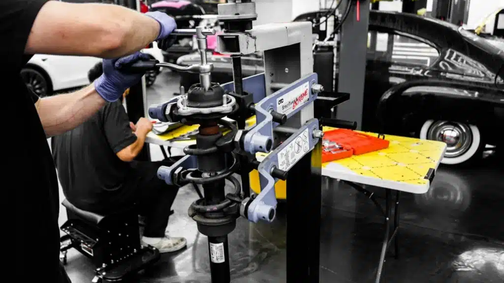 Auto Dealership Lead Generation Agency Photo A Auto Dealership Test-drive Booking Services: mechanics working with tools in a service garage