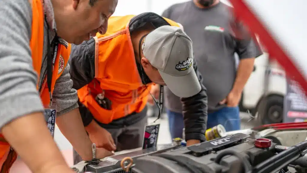 Auto Dealership Marketing Agency Photo B Auto Dealership Marketing Company: automotive technicians diagnosing a car together