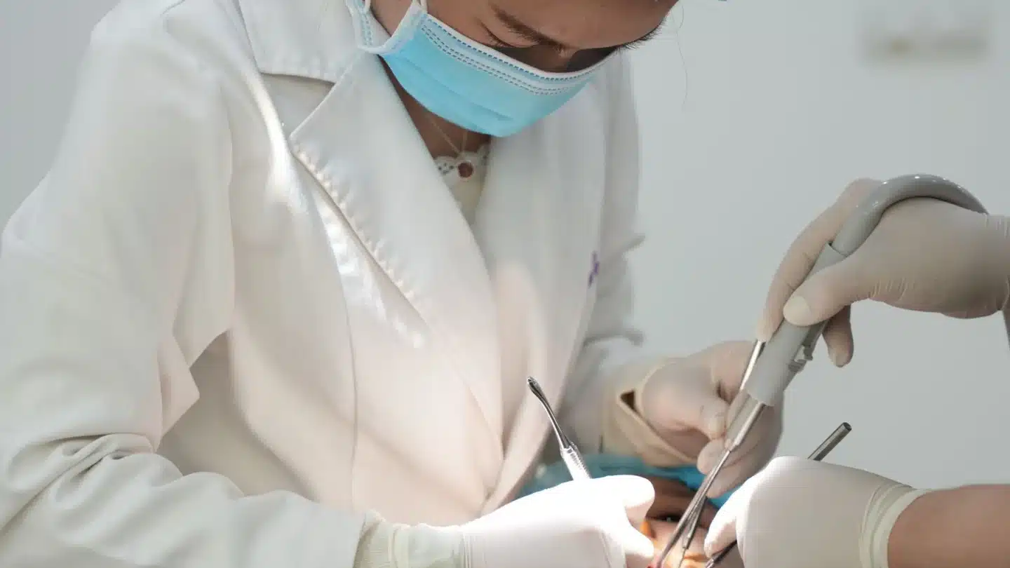 Cosmetic Dentistry SEO Agency Hero Cosmetic Dentistry SEO Agency: dental professionals performing an oral procedure