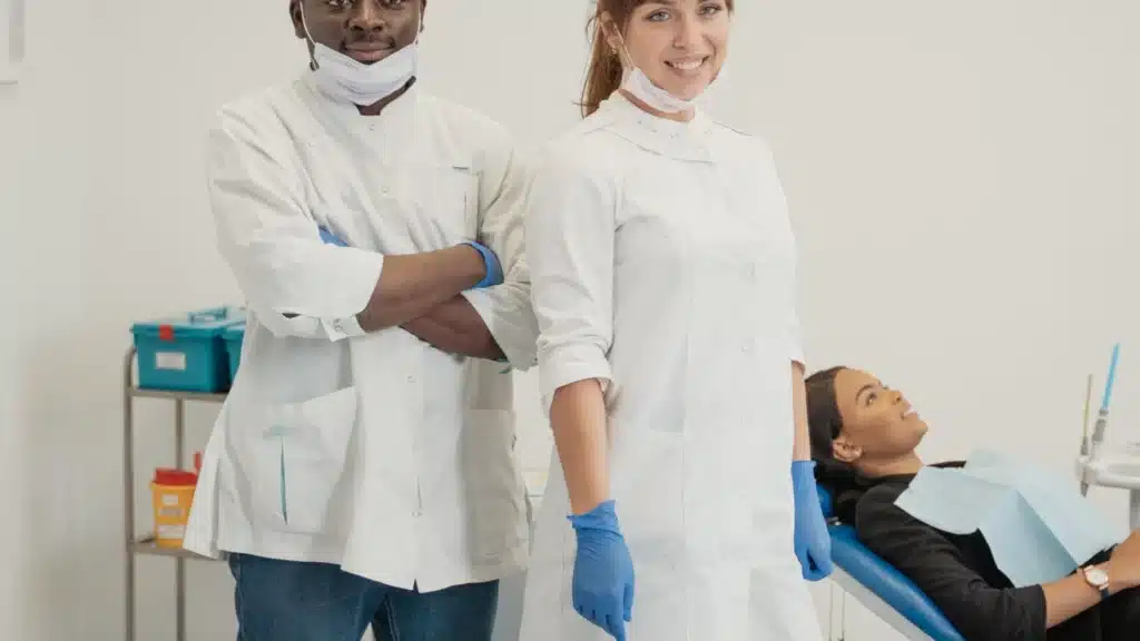 Dental and DSO Digital Marketing Company: dentists and patient in a professional treatment room