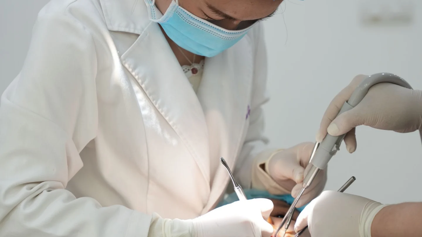 Orthodontic Marketing Agency: dental professionals performing an oral procedure
