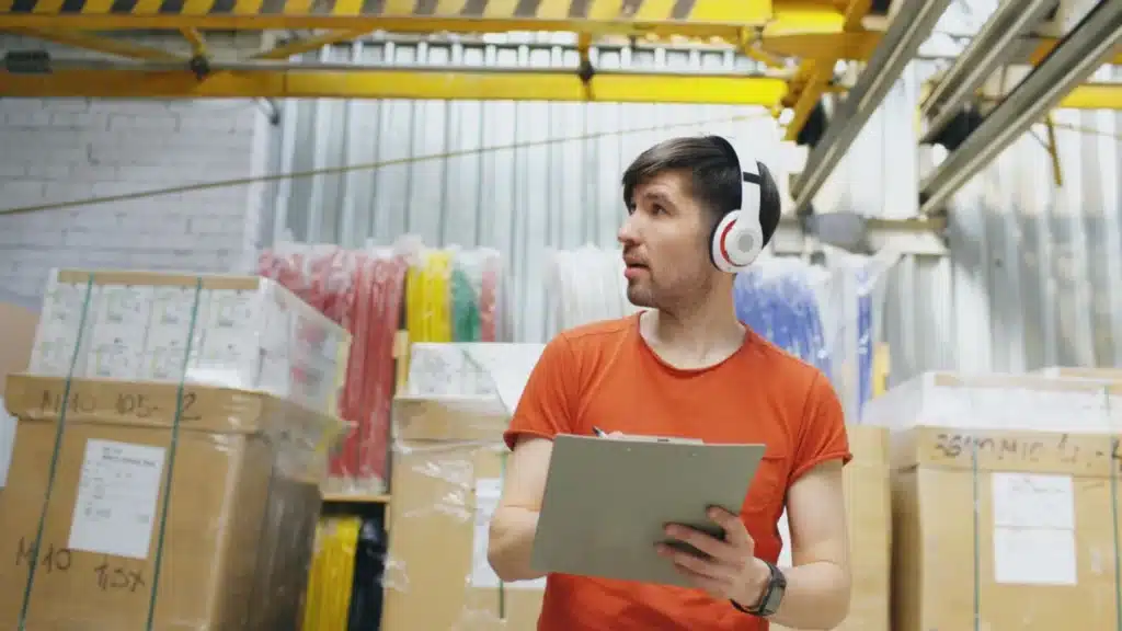 Beauty and Fashion Ecommerce CRO Agency Photo B Beauty and Fashion Ecommerce Customer Acquisition Agency: warehouse worker checking stock and orders