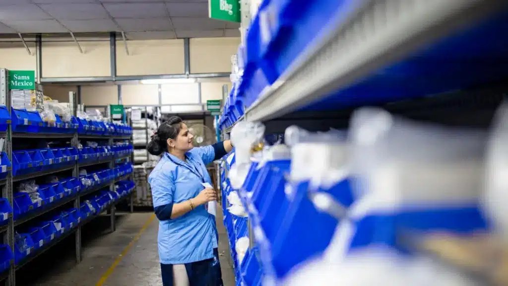 SEO Services for Health and Wellness Ecommerce: worker organizing products in warehouse bins