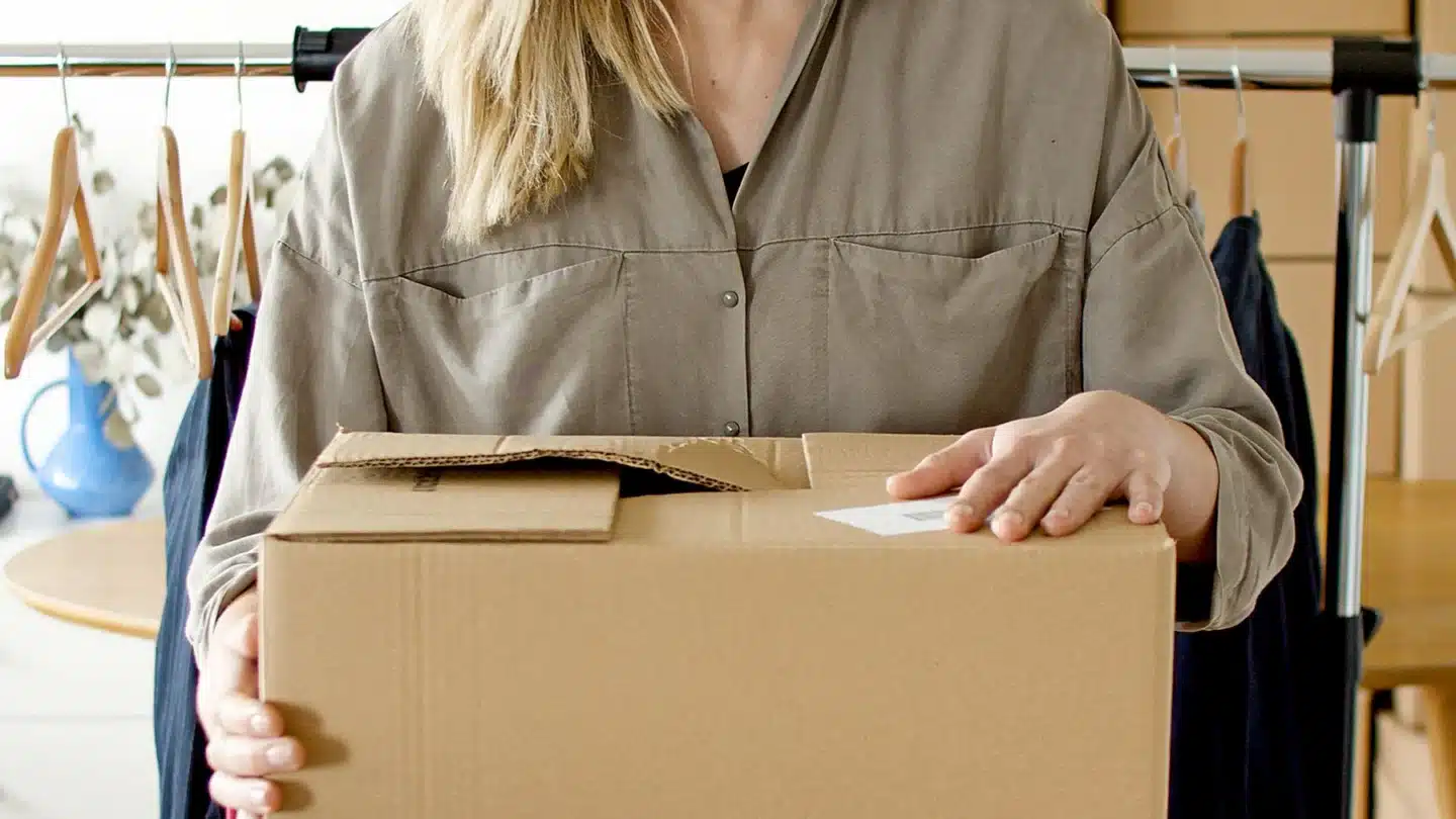 Ecommerce and DTC Marketing Agency: online store owner preparing a customer package