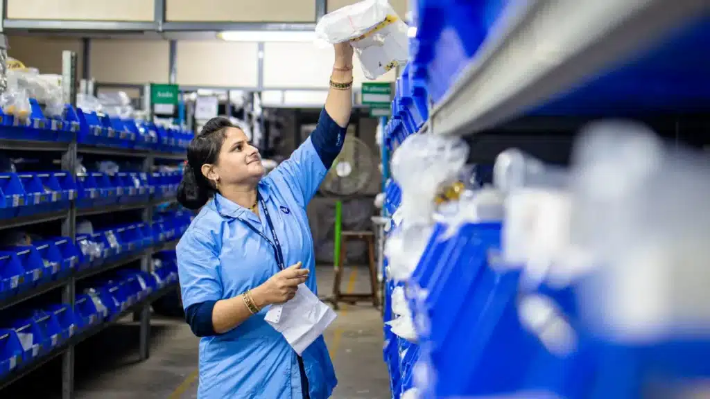 Ecommerce and DTC SEO Agency: warehouse worker organizing ecommerce inventory