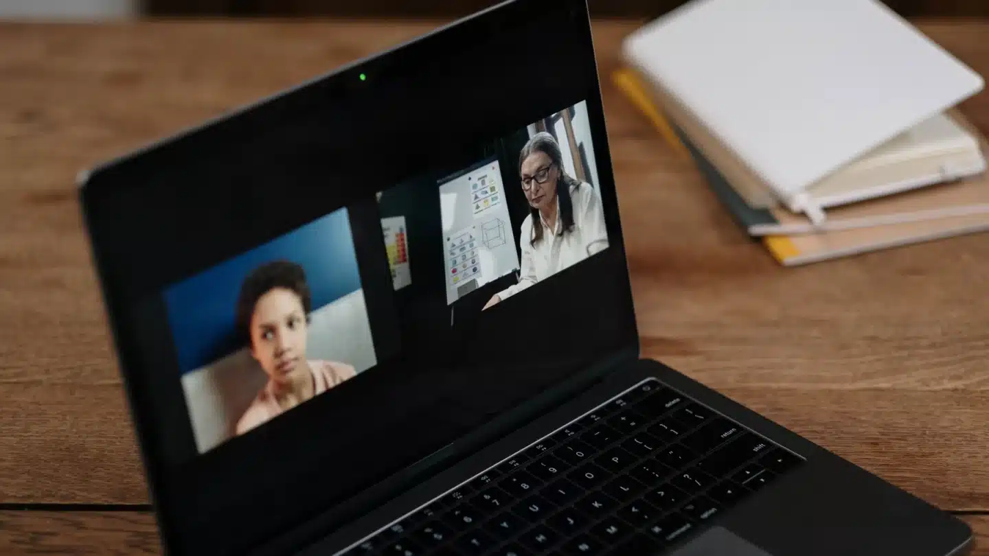 Higher Education Digital Marketing Agency: instructor teaching an online class through a laptop