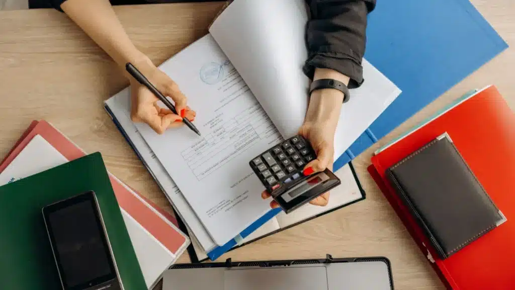 Business Lending SEO Company: professional reviewing accounting documents and calculations