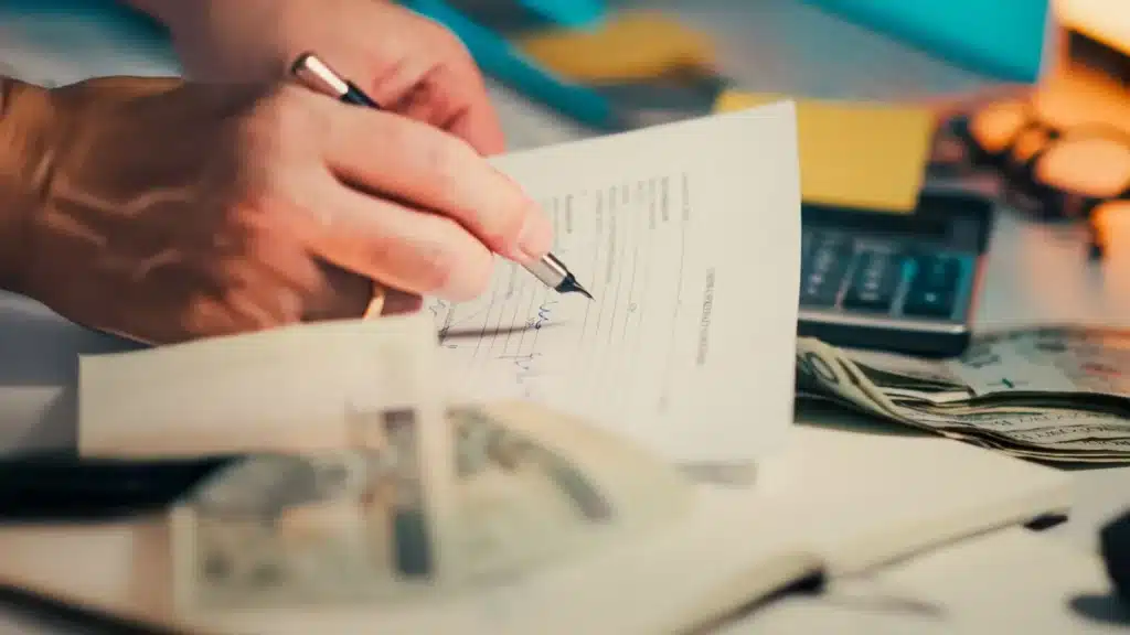 Wealth Management Marketing Company: business desk with financial documents and contract materials