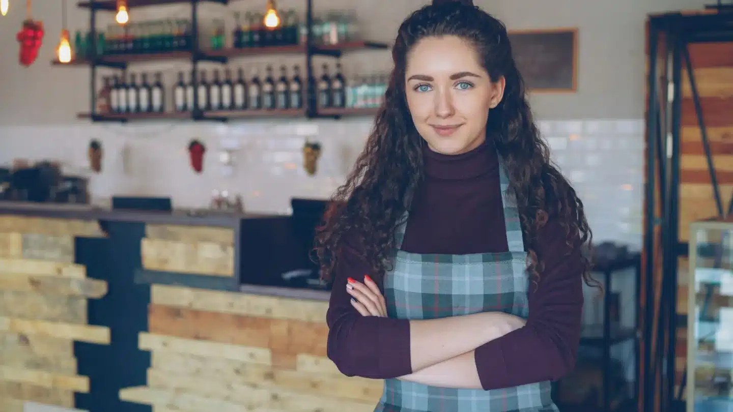 Home Services Franchise AI SEO Agency: cafe owner serving customers in a retail location
