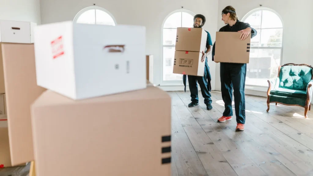 SEO Services for Moving: uniformed movers handling boxes during a relocation