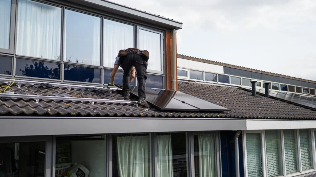 Solar Installation Marketing Agency Photo A Solar Installation Digital Marketing Agency: technician installing solar panels on a residential roof