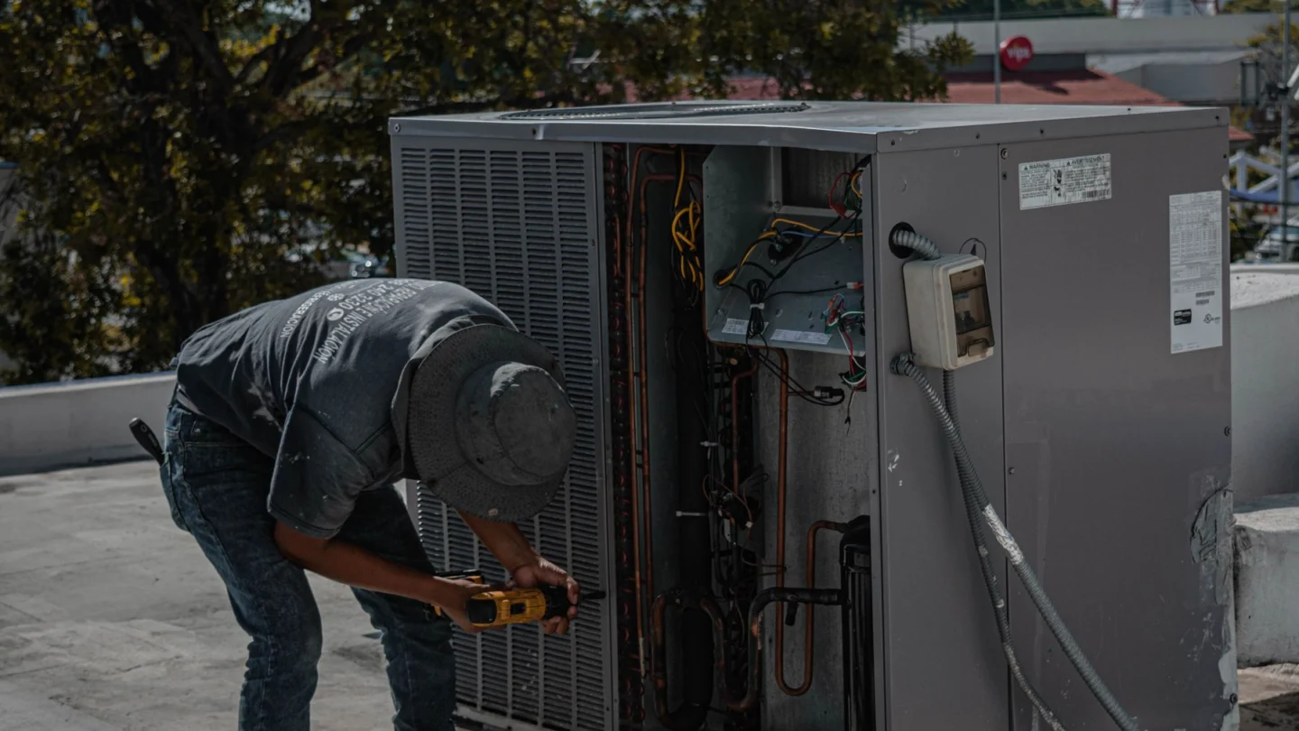 Water Damage Restoration AI SEO Agency: hVAC professional installing air conditioning equipment