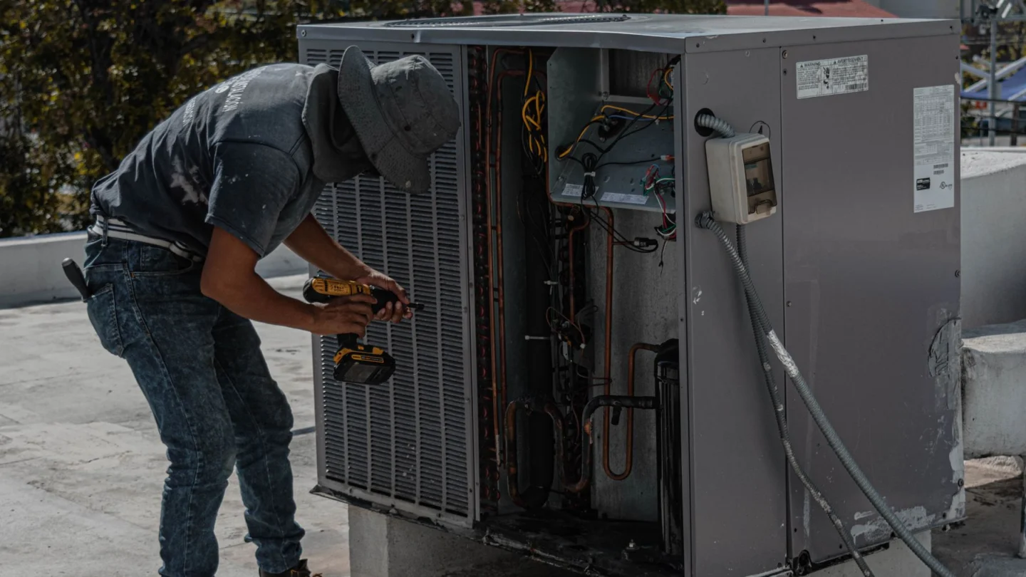 Water Damage Restoration SEO Agency Hero Water Damage Restoration SEO Agency: technician repairing an outdoor HVAC unit