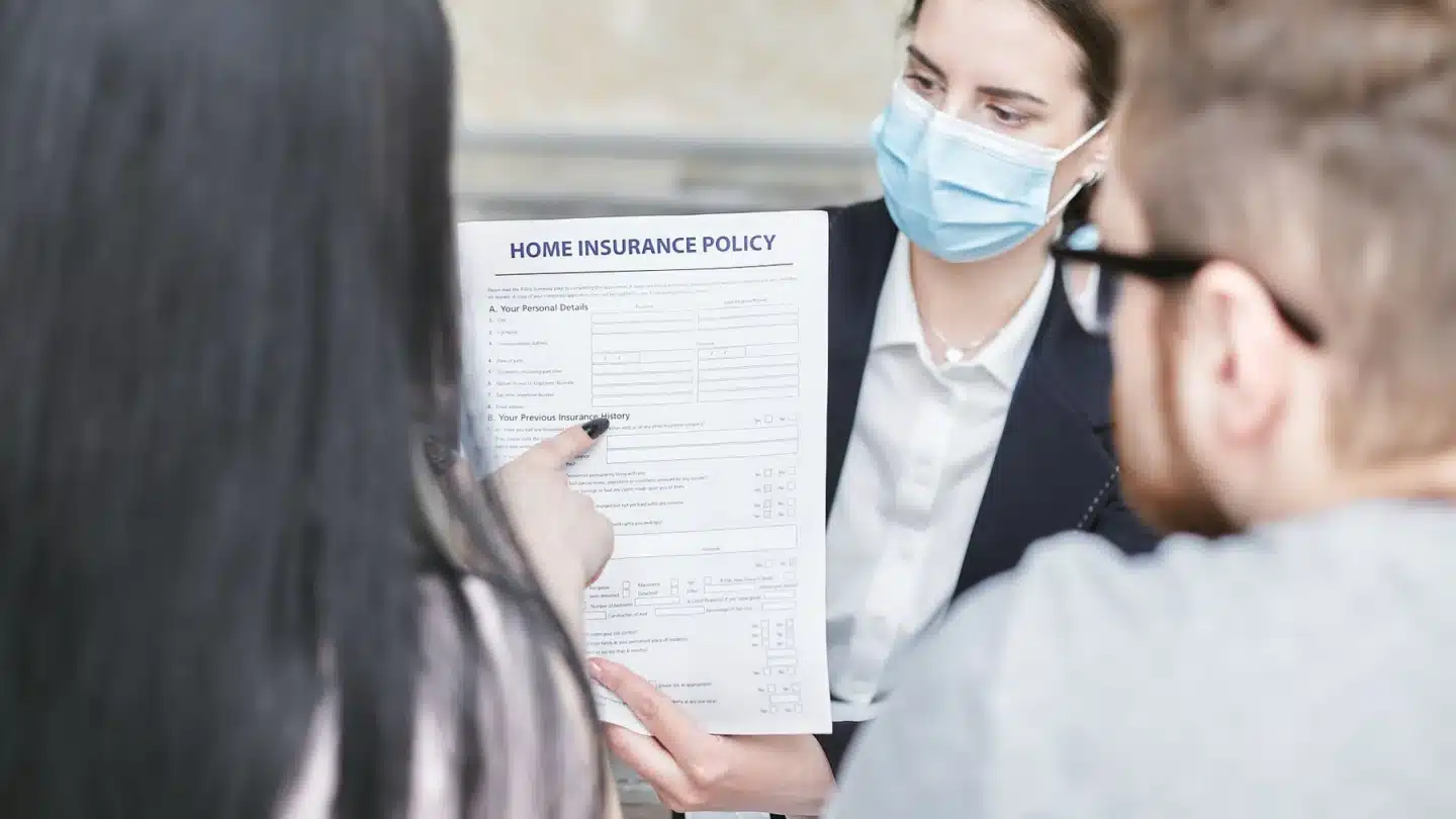 Commercial Insurance AI SEO Agency Hero Commercial Insurance AI SEO Agency: advisor explaining an insurance document to clients