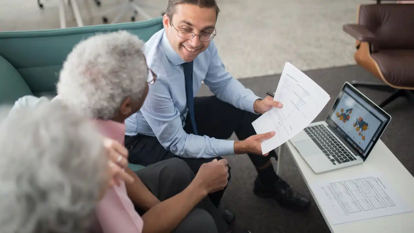 Commercial Insurance Lead Generation Agency: advisor helping older clients understand coverage