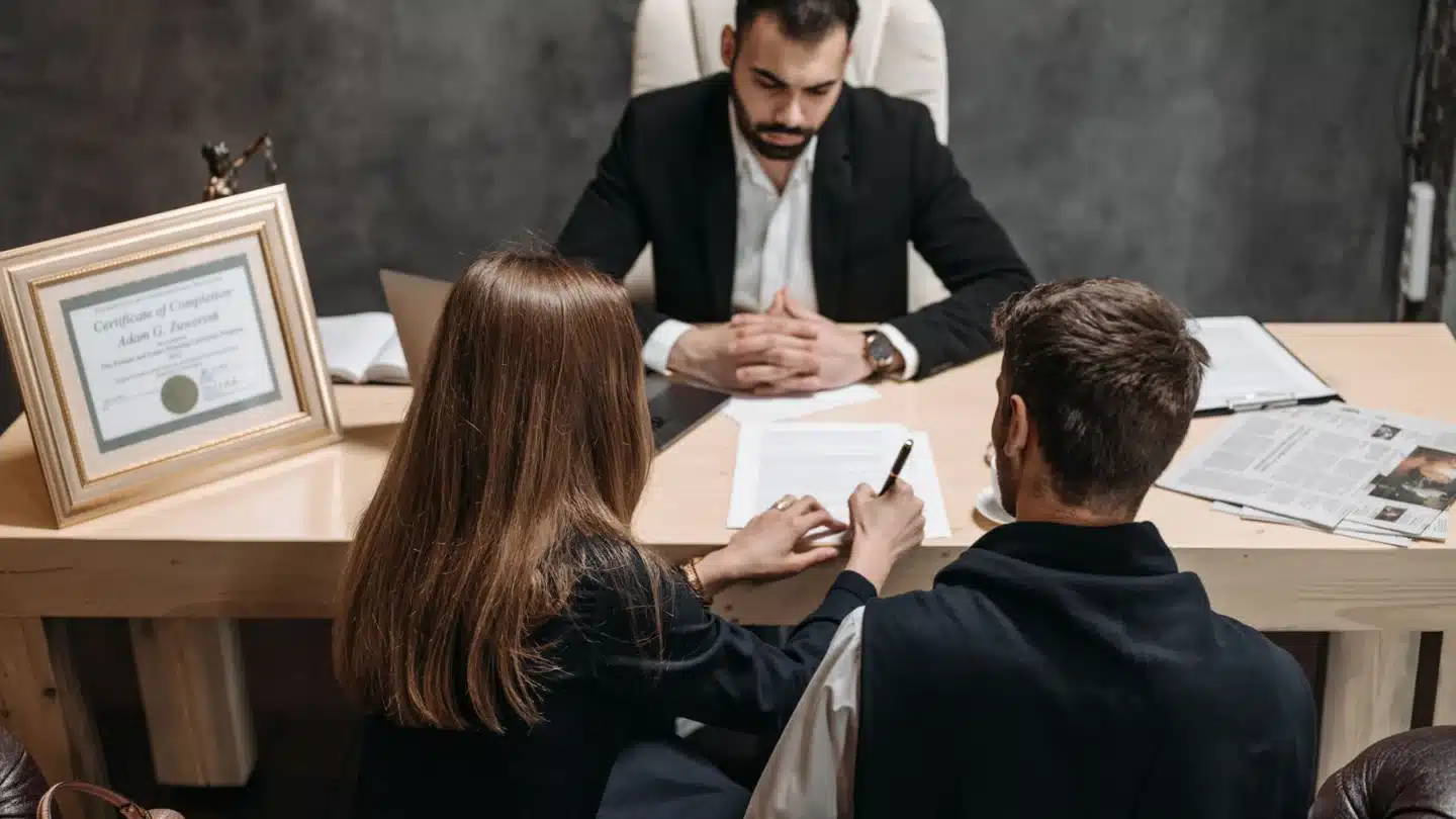 Law Firm Marketing Agency: lawyer consulting with clients in a professional office