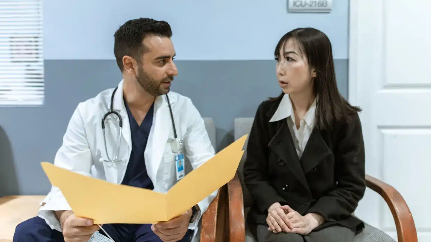 Specialty Medical Practice Marketing Agency: physician consulting with a patient in a clinical setting