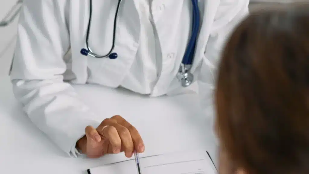 Orthopedic PPC Agency Photo A Orthopedic Google Ads Agency: medical practitioner reviewing a chart with a patient