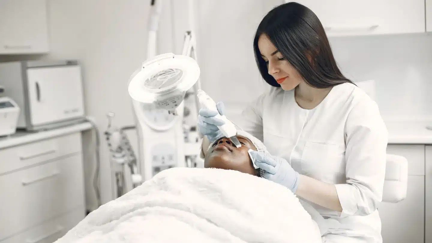 Body Contouring PPC Agency Hero Body Contouring PPC Agency: patient receiving a professional facial treatment
