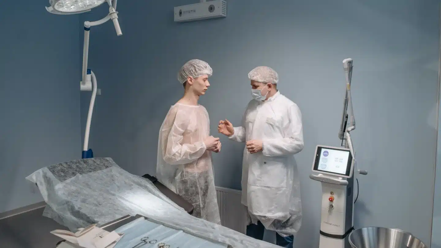 Plastic Surgery and Aesthetic Medicine Marketing Agency: plastic surgeon and patient discussing treatment options during a private consultation in a mod...