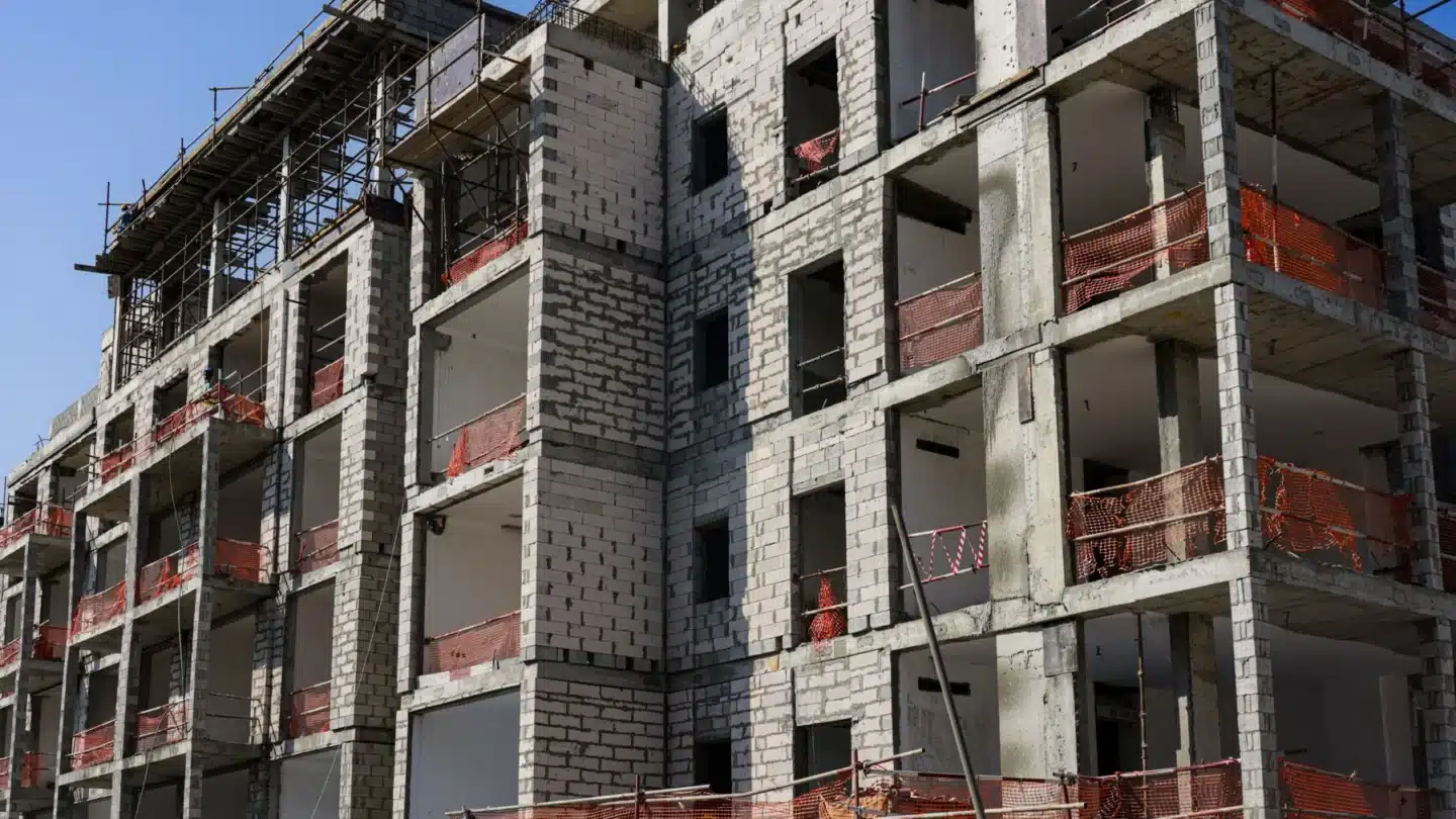 Property Management AI SEO Agency Hero Property Management AI SEO Agency: modern apartment complex under construction