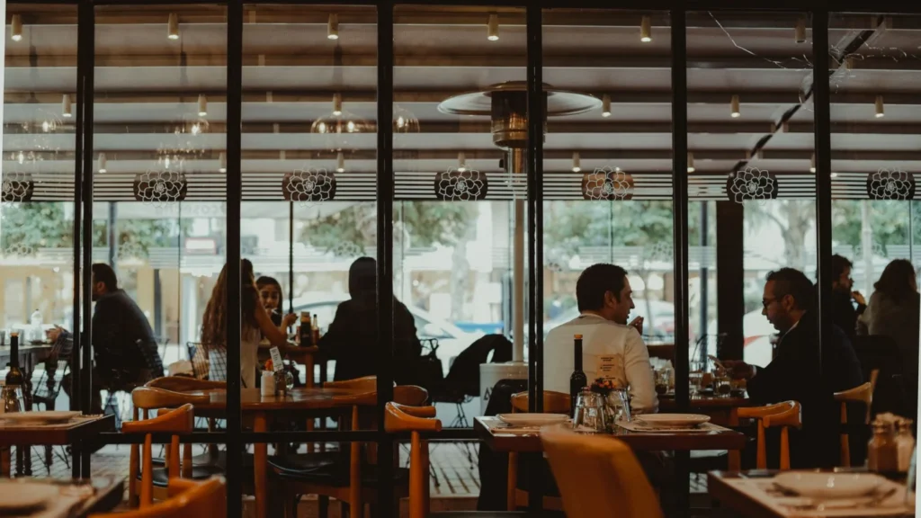 Restaurants PPC Agency Photo B Restaurants Paid Search Agency: restaurant host greeting diners