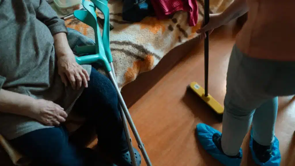 Assisted Living Marketing Company: home caregiver assisting with household tasks