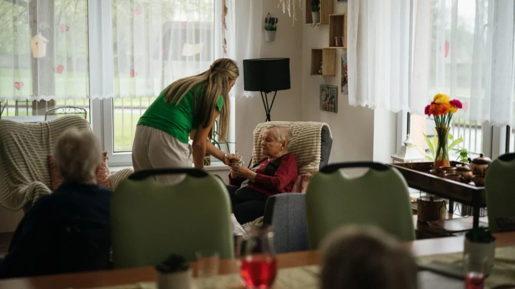 Nursing Homes and Skilled Nursing Facilities Referral and Admissions Growth Agency Photo A Nursing Homes and Skilled Nursing Facilities Senior Care Lead Generation Agency: caregiver spending time with residents in a nursing home