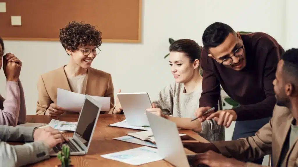 Executive Search Lead Generation Agency Photo B Executive Search Job Order Generation Company: professionals collaborating around a conference table
